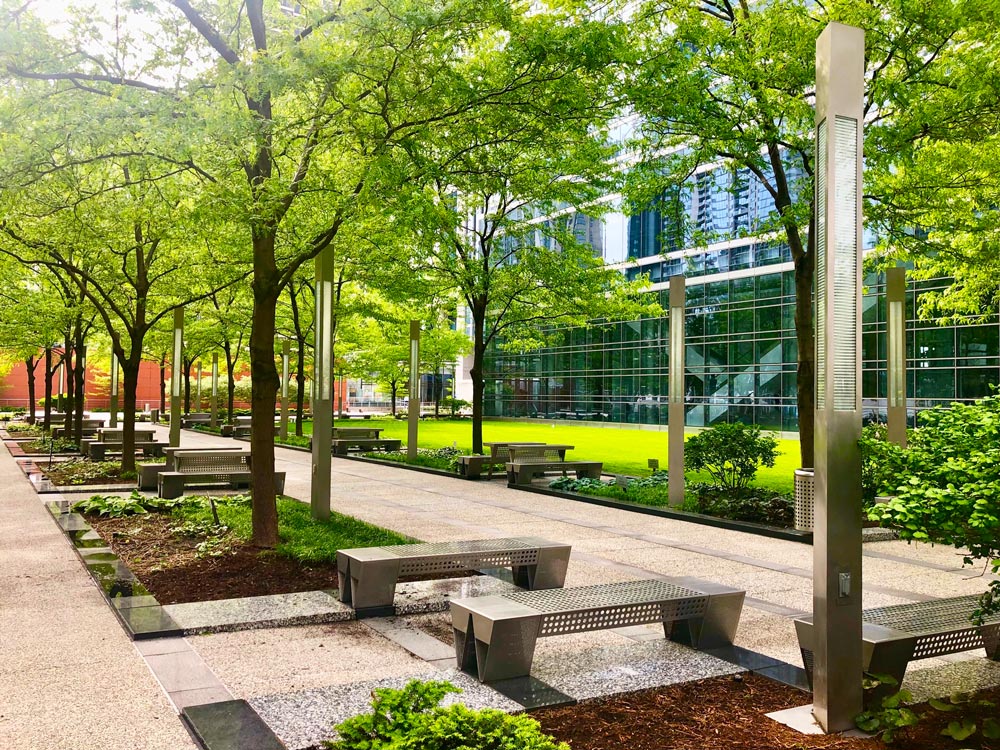 Exterior landscaping with many benches